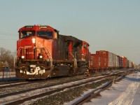 Train M36921 14 approaches Belleville with a long and heavy train of forest products and this and that