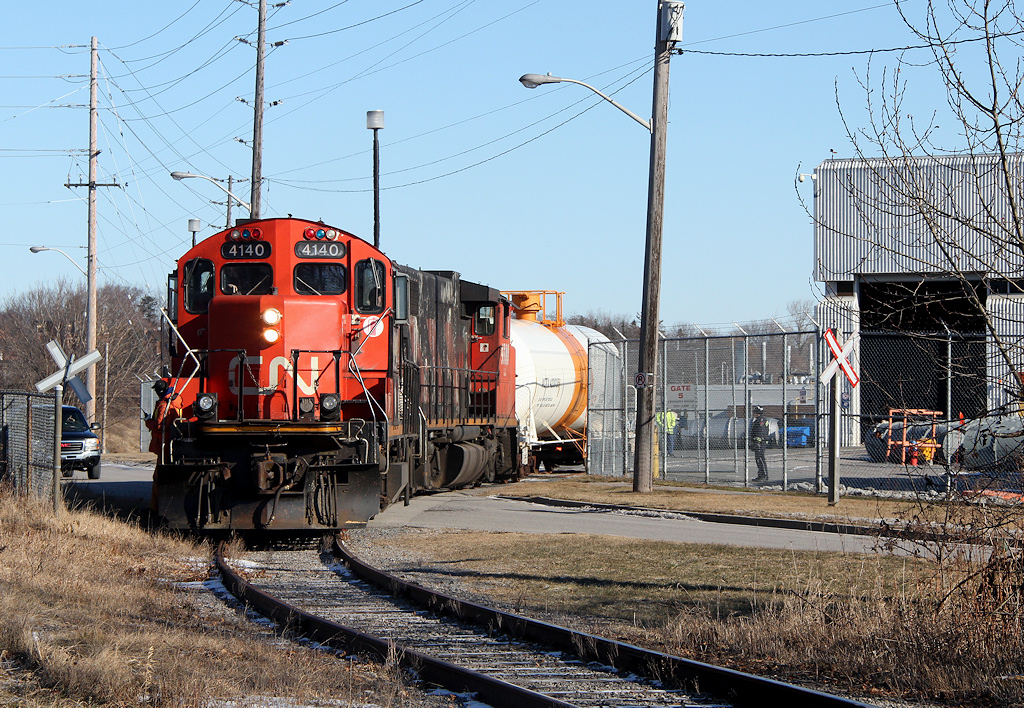 Since changing ties through here in 2010 I was hoping to get a shot with Cameco in the back ground, but with the sun and this train always runs mid morning I guess that is impossible... Here train 518 delivers one car to a long time single carload customer.