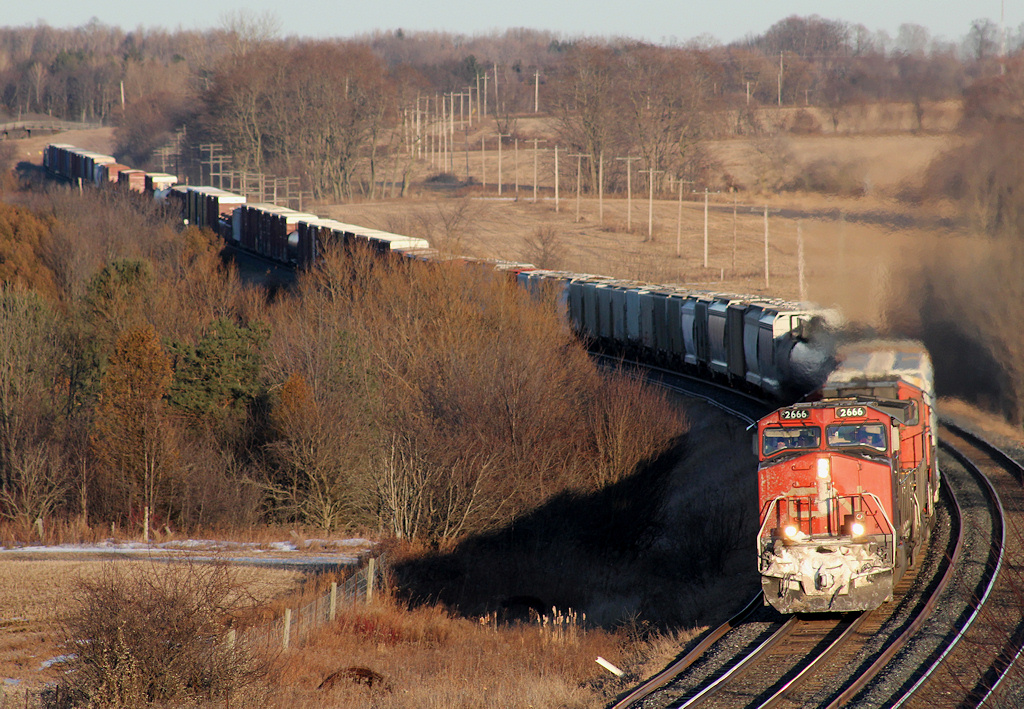 CN M36921 17 heads through Newtonville with a short train, lifted quite a bit from Belleville... Dosent like like a 369 today, no lumber...