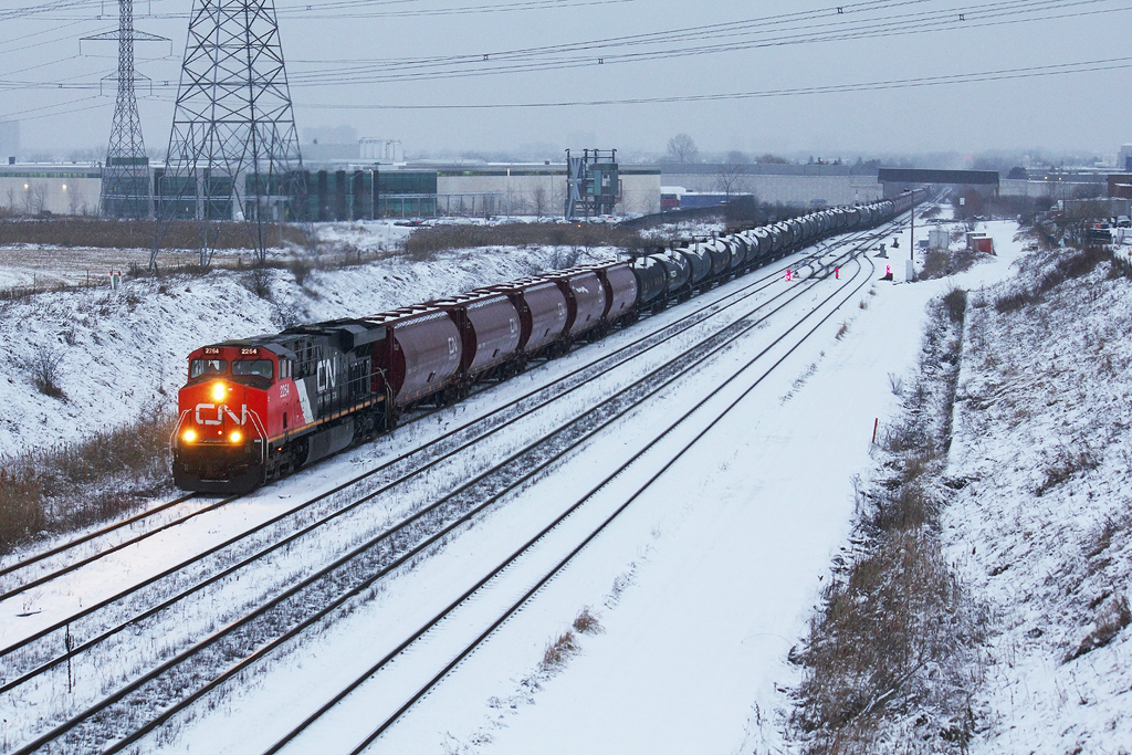 CN M305 is a kind of a big deal around these parts today with 8000+ feet of train behind the lead GEVO...with the help of another ES44DC somewhere there in the middle as both units lug their shares of this monster into Mac Yard.