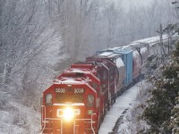 The Havelock Job meanders down the Kawartha Lakes Railway Havelock Subdivision with 3038 leading three other geeps and 32 cars for Toronto from Peterborough.