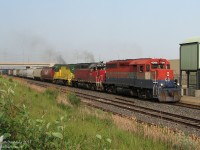 After dropping off leader 3835 at CN’s MacMillan Yard for wheel work and lifting its interchange traffic, GEXR #431 with the typical mixed-bag lashup of 4-motor units howls through Bramalea GO Station on CN’s Halton Sub. GP40’s RLK 4096, GEXR 4019 and 4046 are left to do the honours this evening.