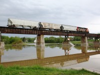 SOR 597 crosses the Caledonia bridge over the Grand River.  They have three cars in tow for Garnet yard to be taken to Brantford for the CN interchange.