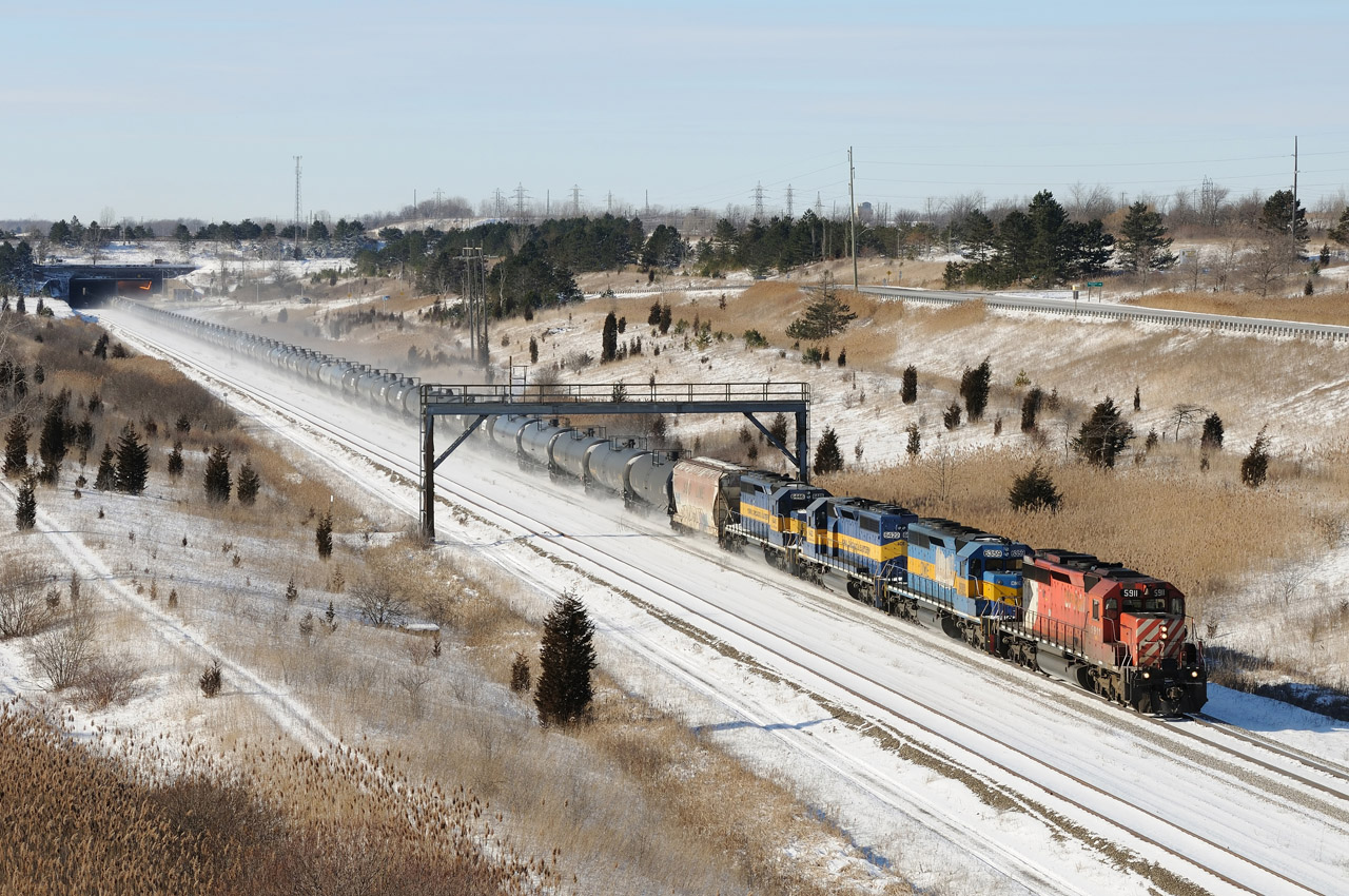Ethanol train CP 626 passes under the Welland Canal at the Townline Tunnel. CP 5911 - DME 6359 -  ICE 6422 - ICE 6446.