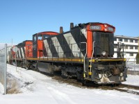 A CN local backs up 3 hoppers for the Kellogg factory just outside of downtown London. CN 4131 was where the crew was operating out of, and CN 1412 was trailing.