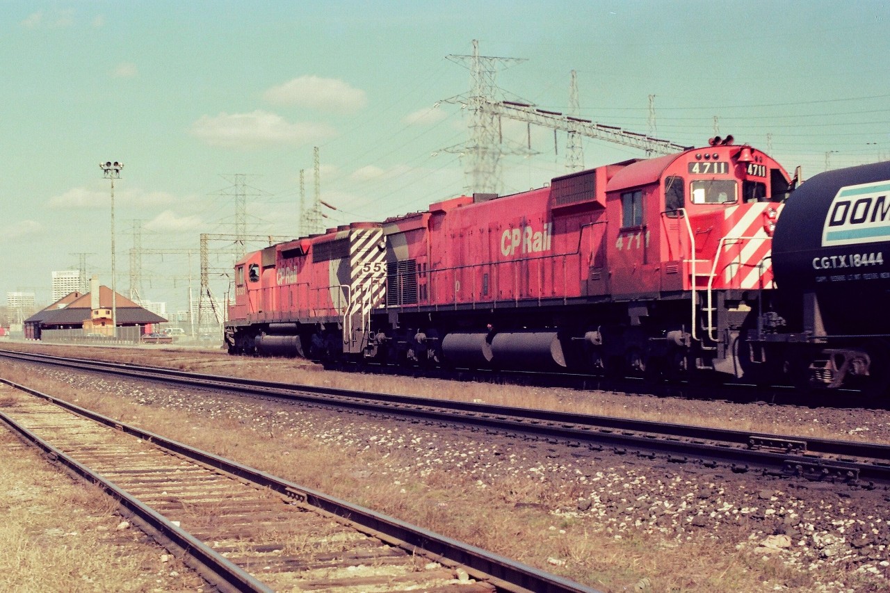 CP Rail Extra 5531 East (white flags), assisted by MLW M636 4711,  approaching the Leaside Village Station Restaurant in this 1978 negative. (Yes, this a trailing shot – exception requested – the approaching shot is severely backlight, in any event thought you may be interested.....). ASA100 Kodak colour negative. Photographer S. Danko.