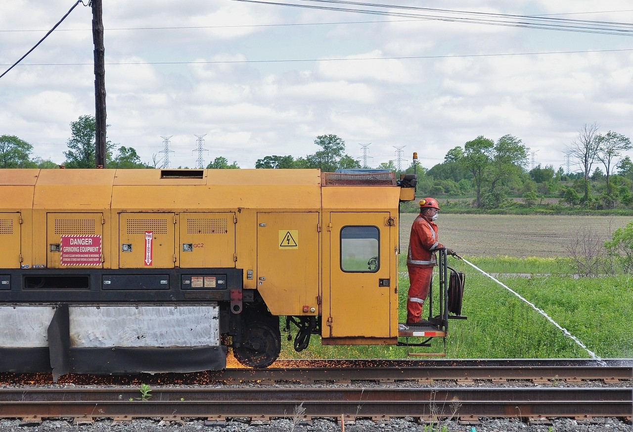 The Loram rail grinder at work CP Belleville Subdivision mile 190.8, Lovekin Ontario. June 2, 2011 image by S.Danko.