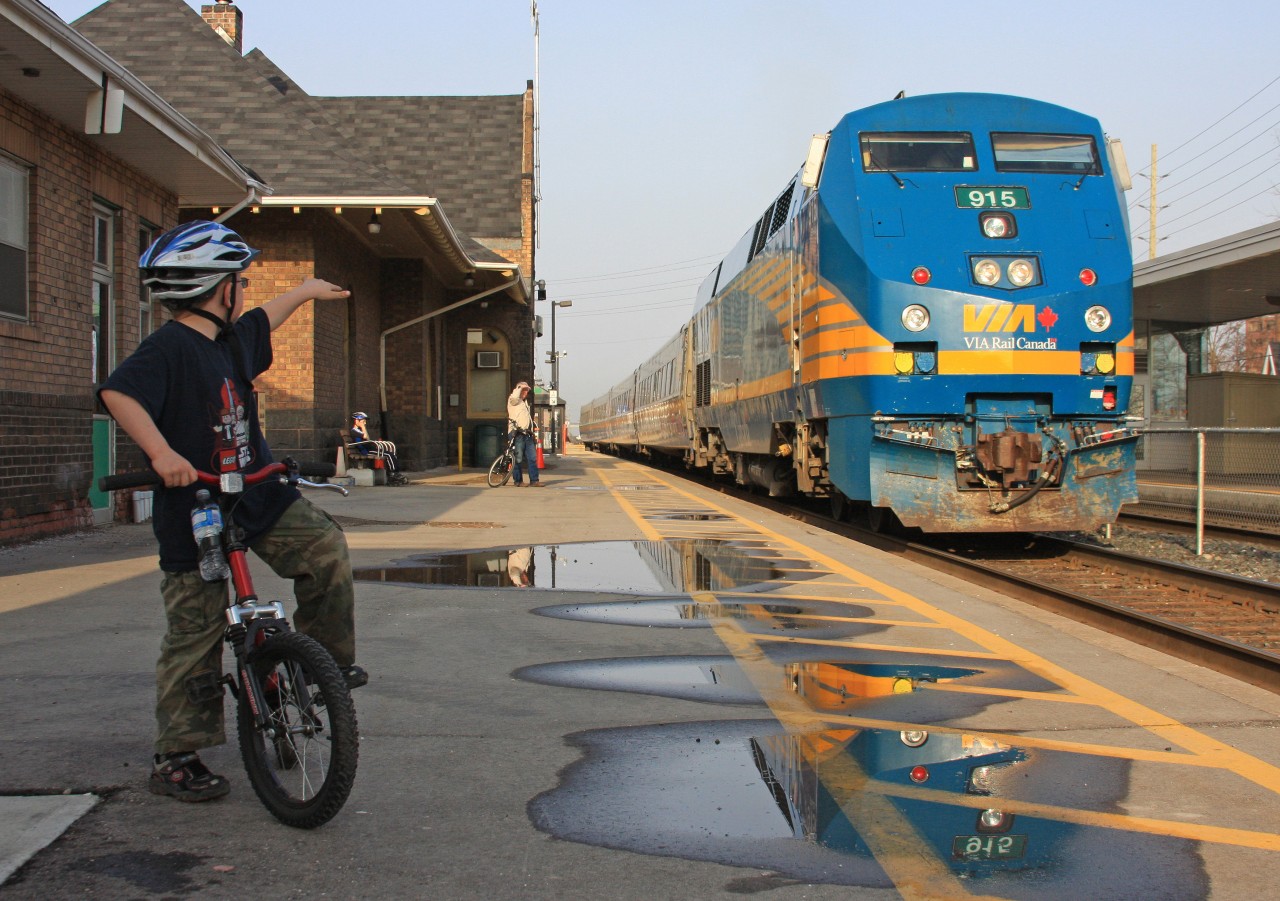 VIA 87 prepares to depart brampton VIA station as a young railfan looks on and waves to the crew