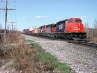 CN 207 coasting slowly on the siding.