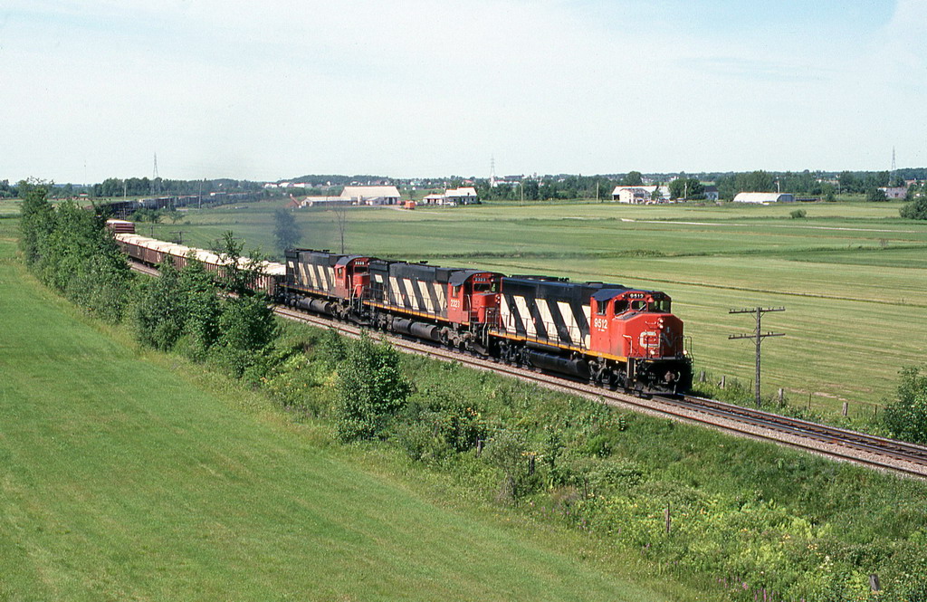 CN 312 about to pass under HW 55 .