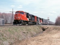 CN 309 with 5619 and 5375 pulls a long string of new TEGX hoppers.