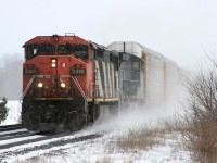 CN 393 kicks up snow as it accelerates through Lynden with 2418 leading the charge