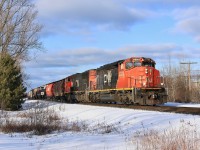 A wide cab SD40-2(W) leads X314 south on the Bala Subdivision at Suez, Ontario.