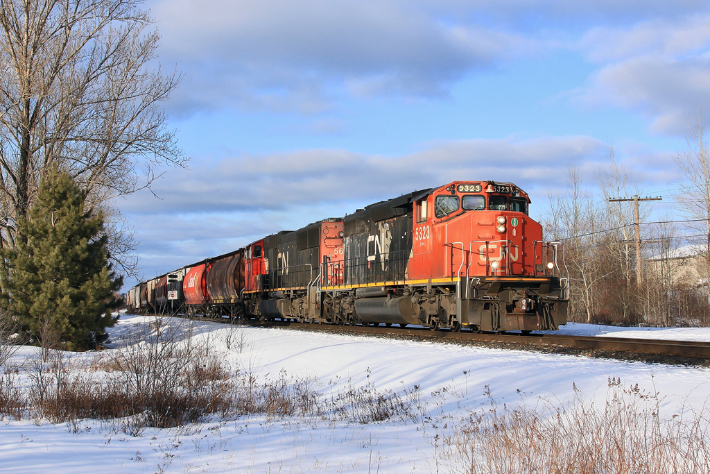 A wide cab SD40-2(W) leads X314 south on the Bala Subdivision at Suez, Ontario.