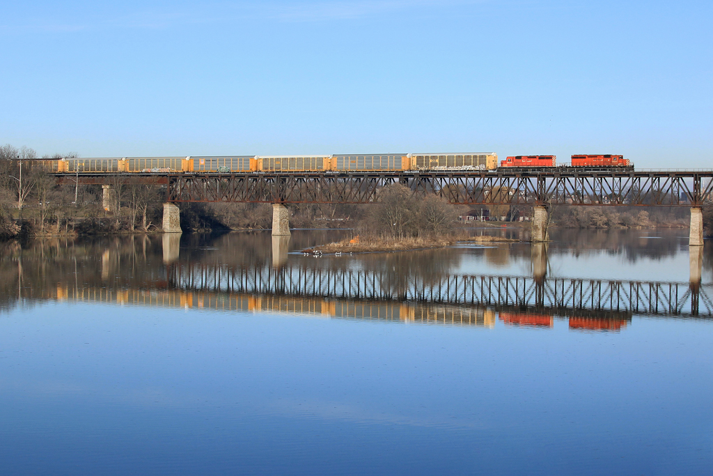 CP 5987 and 5978 lead mixed freight across the Grand River on a pristine Saturday morning.