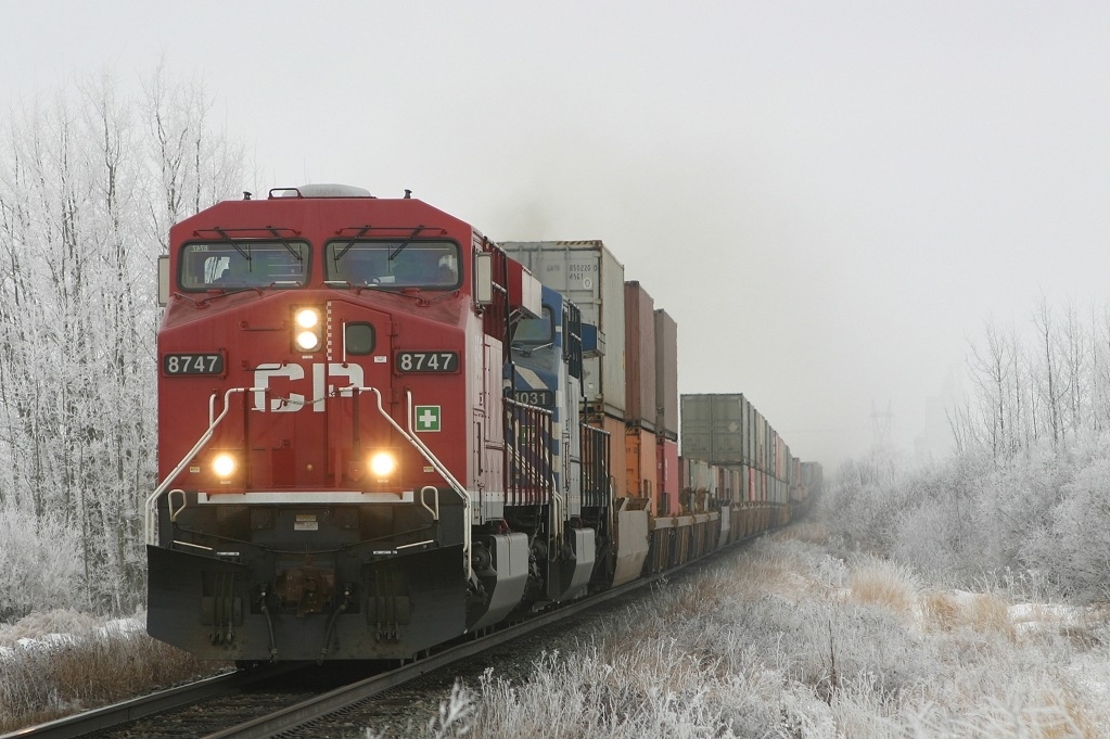CP 8747 leads an eastbound intermodal across the frigid Alberta prairies