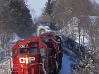 CP 3066 fresh out of the shop leads T08 as 3032, 3038 trail on this 25 or so car train, taking the curve. And thanks to fellow rp.ca contributior Mike Lockwood for the amzing chase up the Havelock Sub and showing a few of his secret spots along the line.