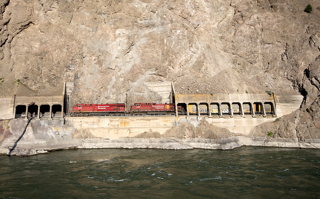 CP 8870, a GE ES44AC w/ the 9723, an AC44CW trailing, head west along the Thompson River at the Skoona Tunnels which are located near Spences Bridge B.C.