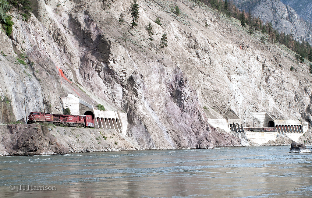 CPX 9740 exits the Skoona tunnels as it travels westward above the Thompson River.