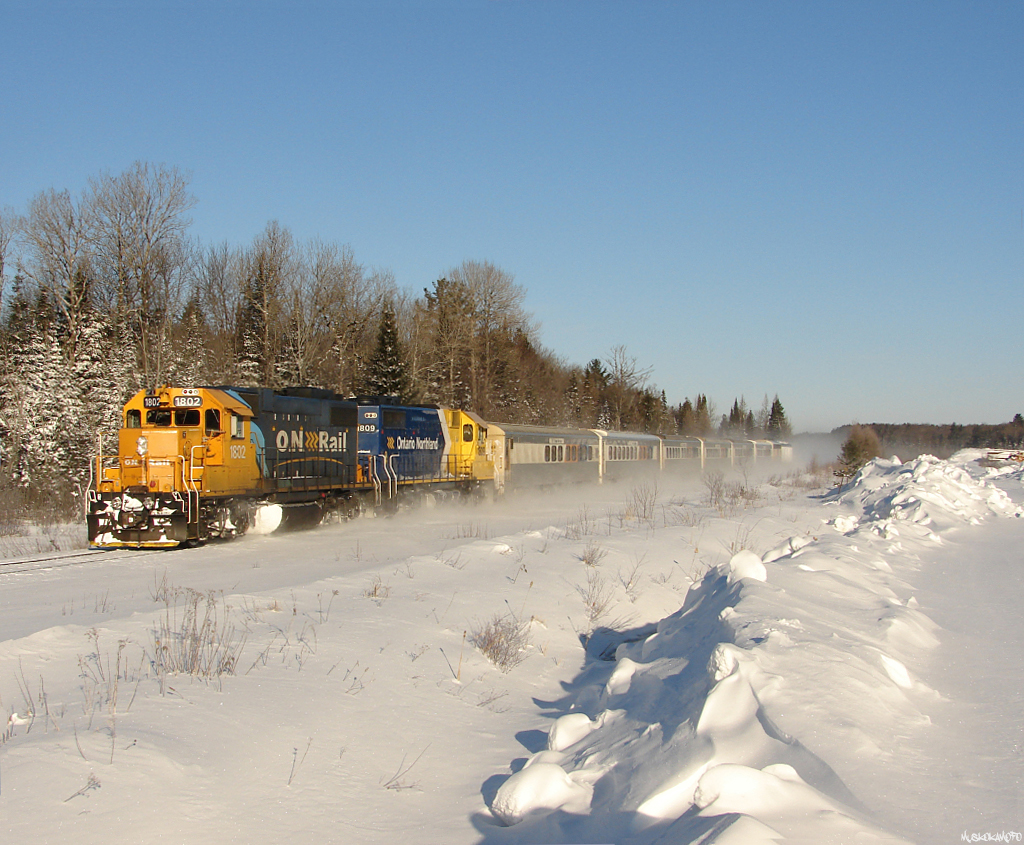 CN X69831 26 - ONT 1802 South kicking up the snow in Falkenburg making up for a bit of lost time after a meet at Martins, transporting Canadian and American troops to Washago to meet their ride back to Base Borden from winter training exercises in the Cochrane area.