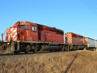CP 441 led by a pair of SD40-2s, heads westbound around the bend in Tilbury on its way towards Windsor.