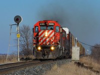 CP 249 led by a pair of SD40-2s, chugs along westbound towards Windsor as it passes the signal at mile 77.4