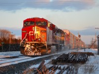 CP 147 west led by CP 8824, ICE 6433 and SOO 6049 passes the east siding switch in Tilbury with the lights dimmed as CP 440 was pulling up in the siding.