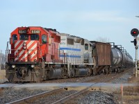 CP 6042 and CITX 3097 proceed to haul this westbound ethanol train into the siding at Tilbury to allow an oncoming eastbound train to pass by.