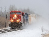 <b><i>Dashing through the Snow.</i></b> CP 119-08, led by CP 8863 and CEFX 1050 kick up the snow through Hurkett, Ontario.
