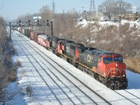 CN 324 departs Montreal\'s Taschereau Yard for St. Albans, VT.  Behind the power is CN private car \"Sandford Fleming\".