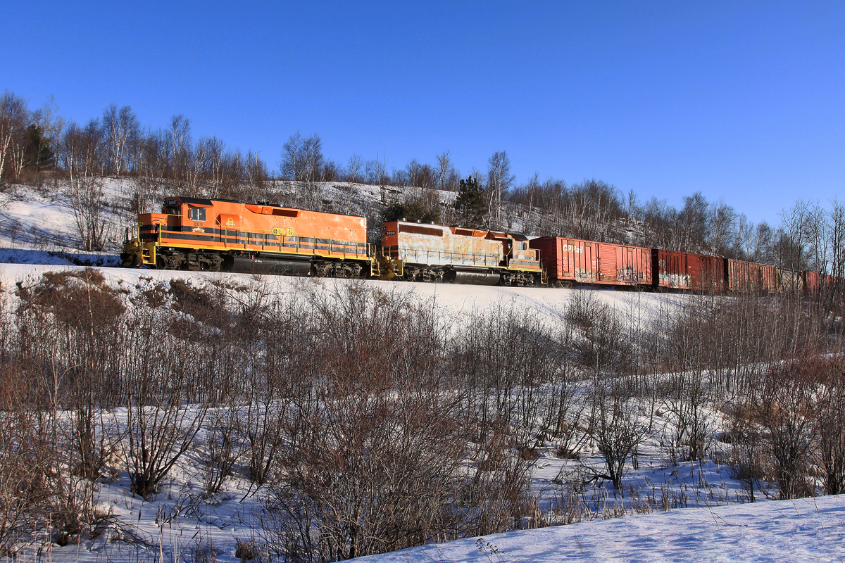 HCRY 800 rounds a curve as it clings to the side of a snow covered hill.