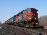 CN G85241 24 passes through Elie, Manitoba with a string of loaded grain from the PNL