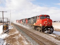 CN M30831 12 passes through Marysville with CN 2565 + CN 2196 at the helm... I guess when they painted the 2196 they forgot to add the numbers to the rear conductors side!