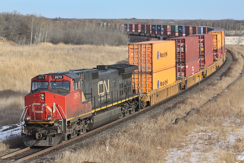 CN C44-9W 2679 is the rear dpu on CN 116 as it heads east out of Rivers.