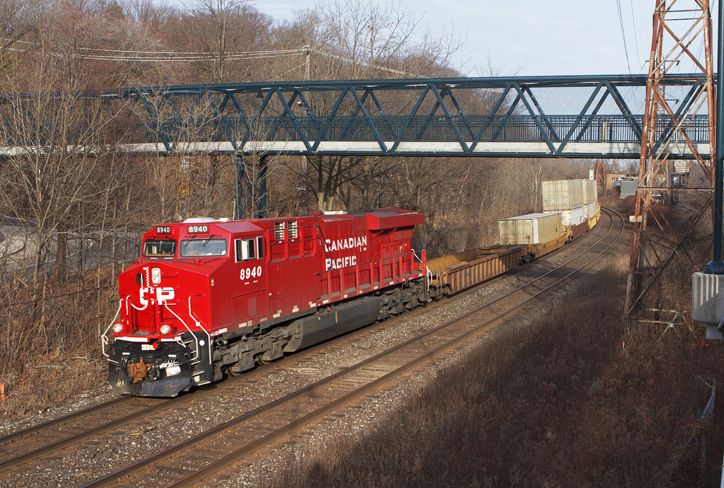 CP 113 highballs thru Rosedale with a new GEVO leading.