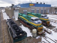 Almost ready for export to Brazil, VALE Mining locomotives 102 and 107 sit idling on flatcars just outside of CRCR's facility at VIA's Toronto Maintenance Centre. Having just received a fresh coat of VALE's grey, turquoise, orange and yellow, shooting these units as the last units to be produced at London EMD was a must.