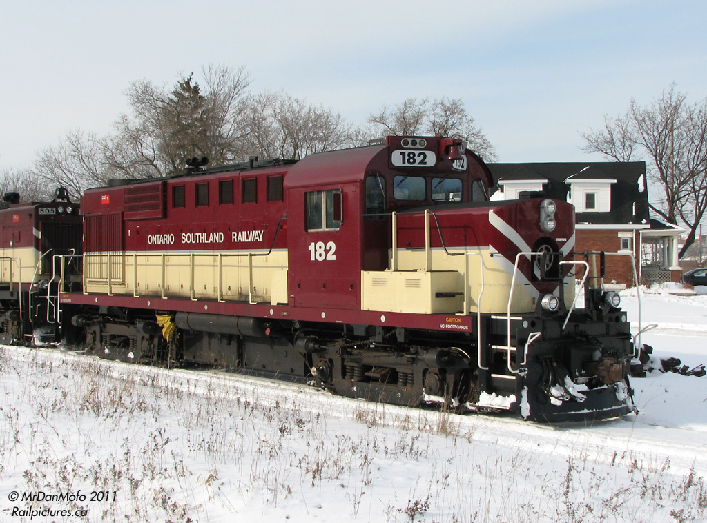 OSRX 182, an ex-CP RS18u, sits near the south end of Guelph near PDI\'s yard after being wyed. Delayed by 2 hours at Campbellville (Guelph Jct) by Transport Canada, 182 and 505 eventually made it here with their train of 2 tank cars and a caboose in tow.