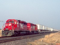 CP SD40-2s 5742 and 5745 (the only units to get the Expressway logos on their long hoods) are seen on #121 at Darlington siding on the Belleville sub in March 2000/