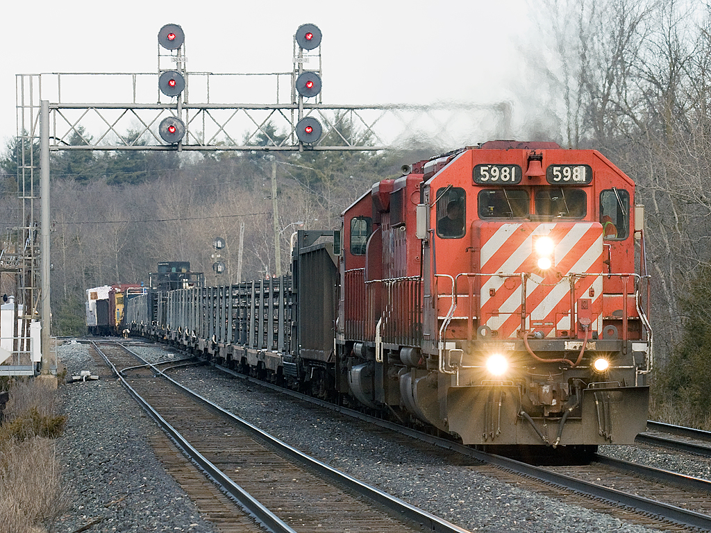 The whole rail train plus the wrong coloured van top the escarpment.