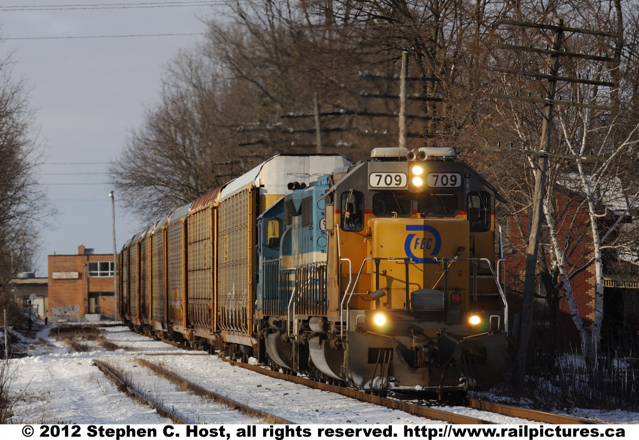 FEC 709 East, GEXR train 432 is passing through Guelph, Ontario on a cold February morning.