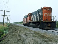CN 514 returns light backward with only its van in tow.