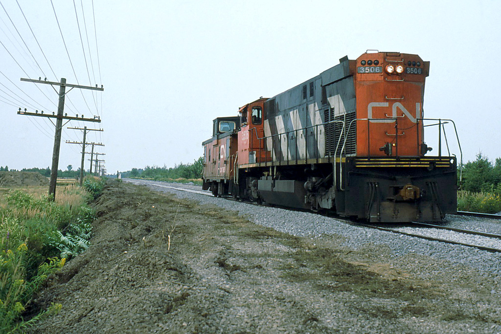 CN 514 returns light backward with only its van in tow.