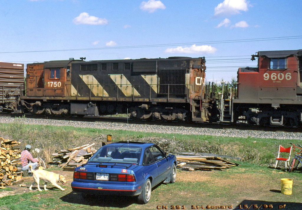 CN 391 with 1750 trailing,an old modified RS-18 with RSC-13 trucks near the end of its career.