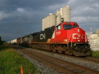 CN 321 gets underway after making a lift at St Marys Cement in Bowmanville under threatening skies