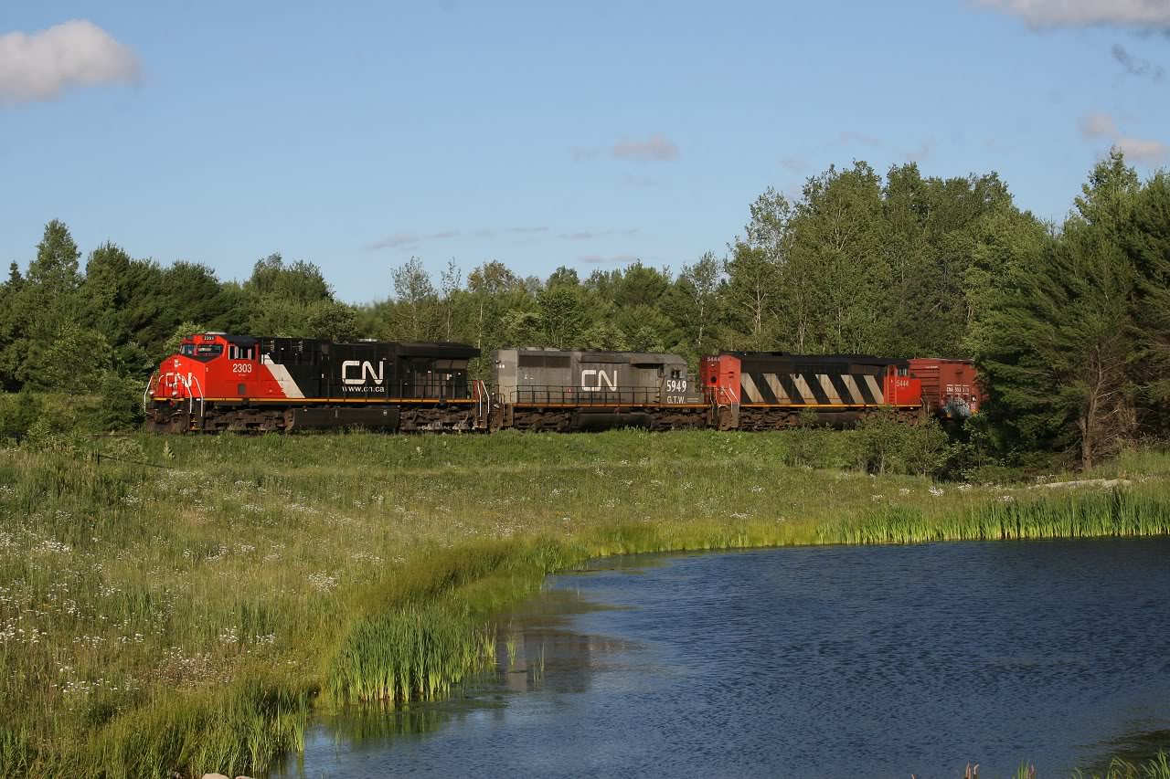 CN 451 rolls through Bracebridge with 2303, GTW 5949 and CN 5444.