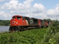 CN 450 skirts Siding Lake after meeting CN 595 at Martins.