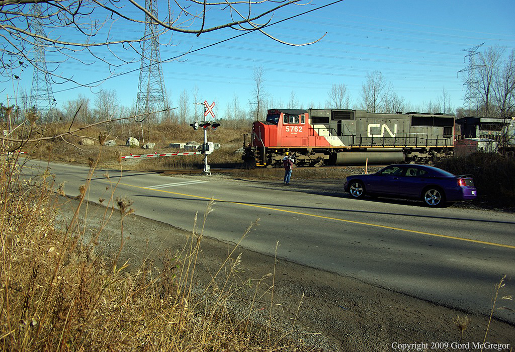 A father and son give a friendly wave after a quick chase from Pickering.