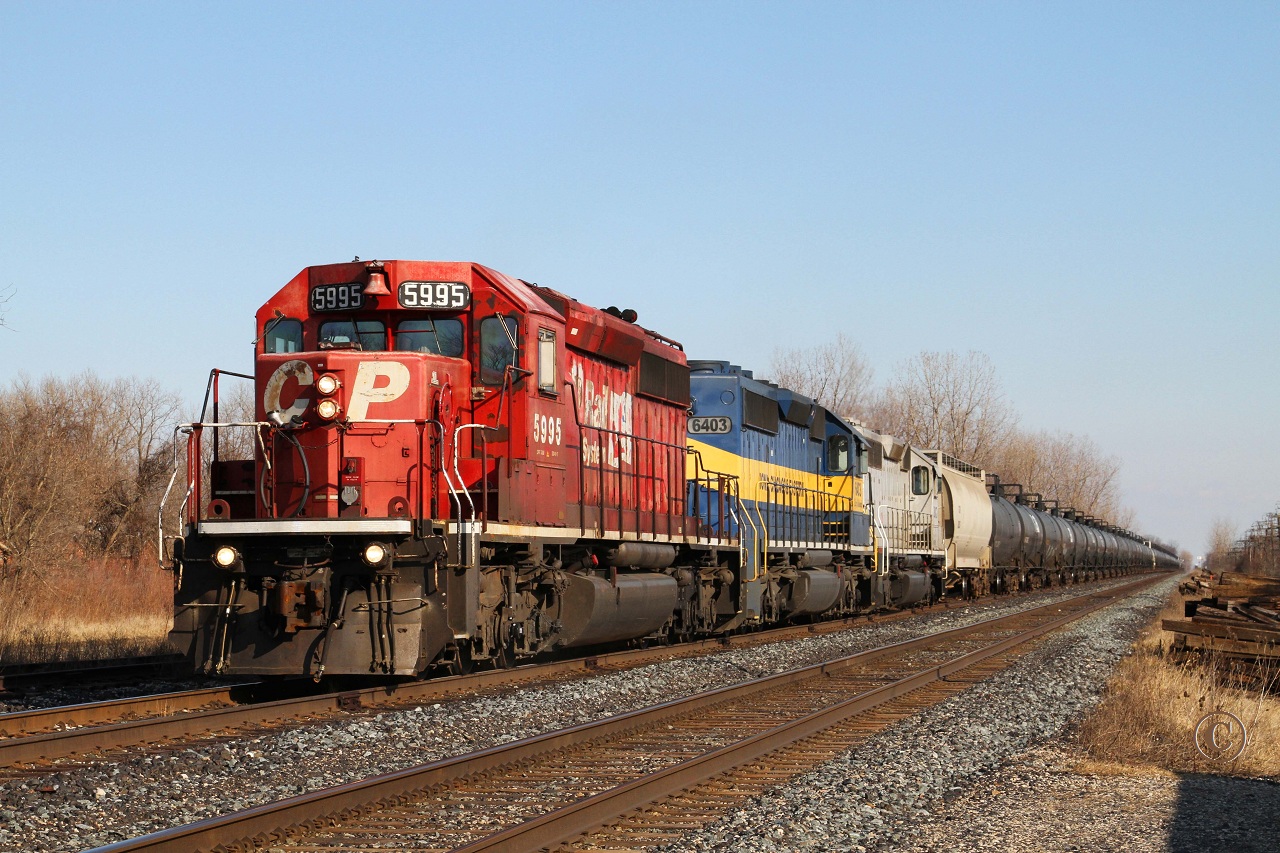 CP 5995 with ICE 6403 and CITX 3082 gets under way with ethanol train 627 from the siding at Belle River, mile 94.1 on the CP\'s Windsor Sub.