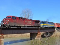 CP 641 led by a CP and a pair of DME heads westbound over the Merlin Road canal bridge.