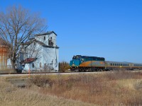 VIA 73 led by 6401 passes by the old grain elevator at Prairie Siding on its way towards Windsor